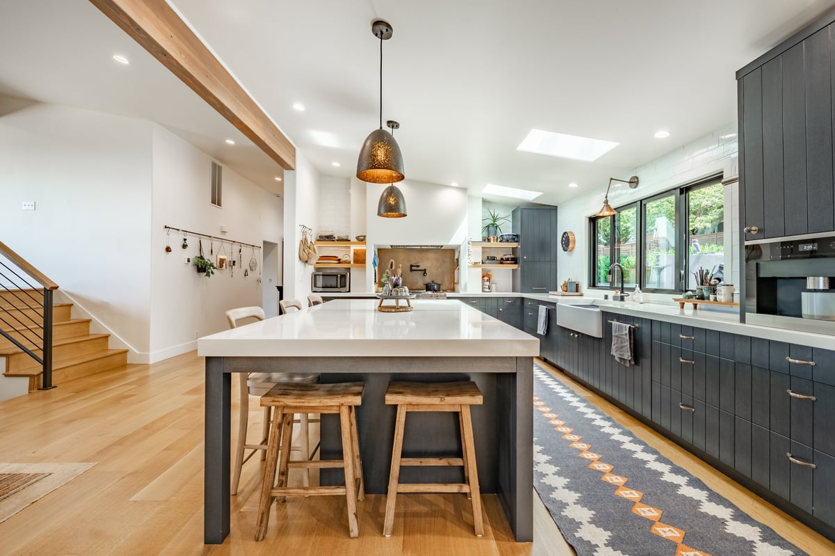 Completed kitchen remodel with an island and pendant lighting